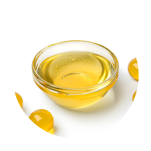 Clear bowl filled with golden Vitamin E oil with softgel capsules around